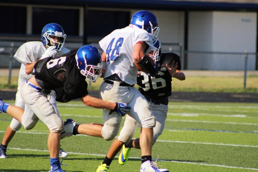 #48 Cody Henderson strives for the goal line at the JV inter-squad scrimmage.